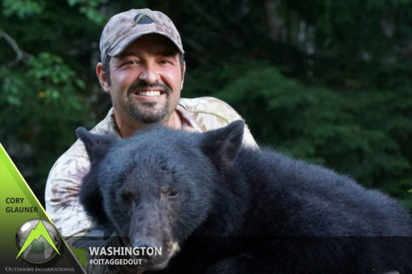 Cory with his… umm…. we’ll just say “huge” Washington black bear.