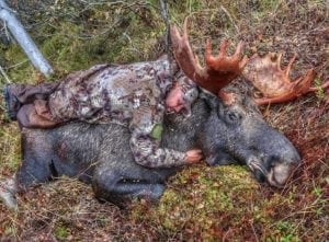 Giving his moose a hug