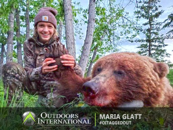 A girl with a good brown bear