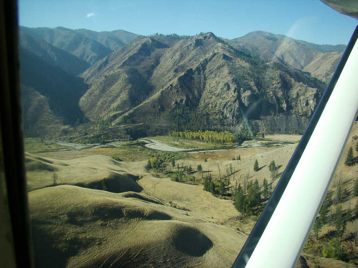 Prior to the fire of 2000 our camp was located on a State Land lease about a ten minute walk from Big Creek. This site lost all of its charm in the fire. So we went searching for a new location for our fishing camp. The result was “Fish Camp“, maybe the most perfect setting for a wilderness, fly in, horseback, fishing camp.