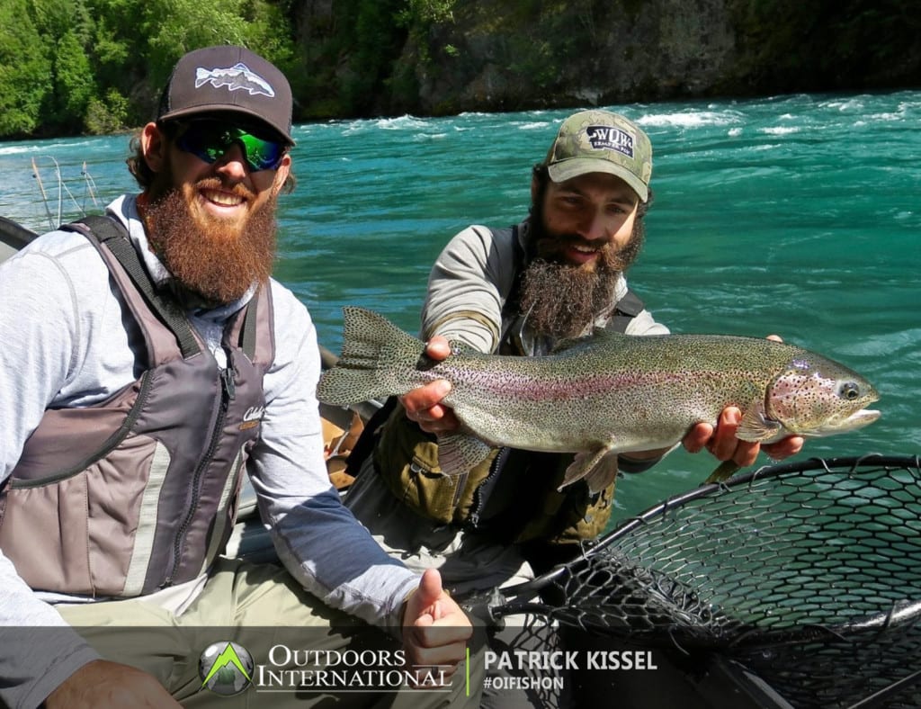 Patrick Kissel with a beautiful Alaska Rainbow trout he caught with our Kenai River Fly Fishing Guides