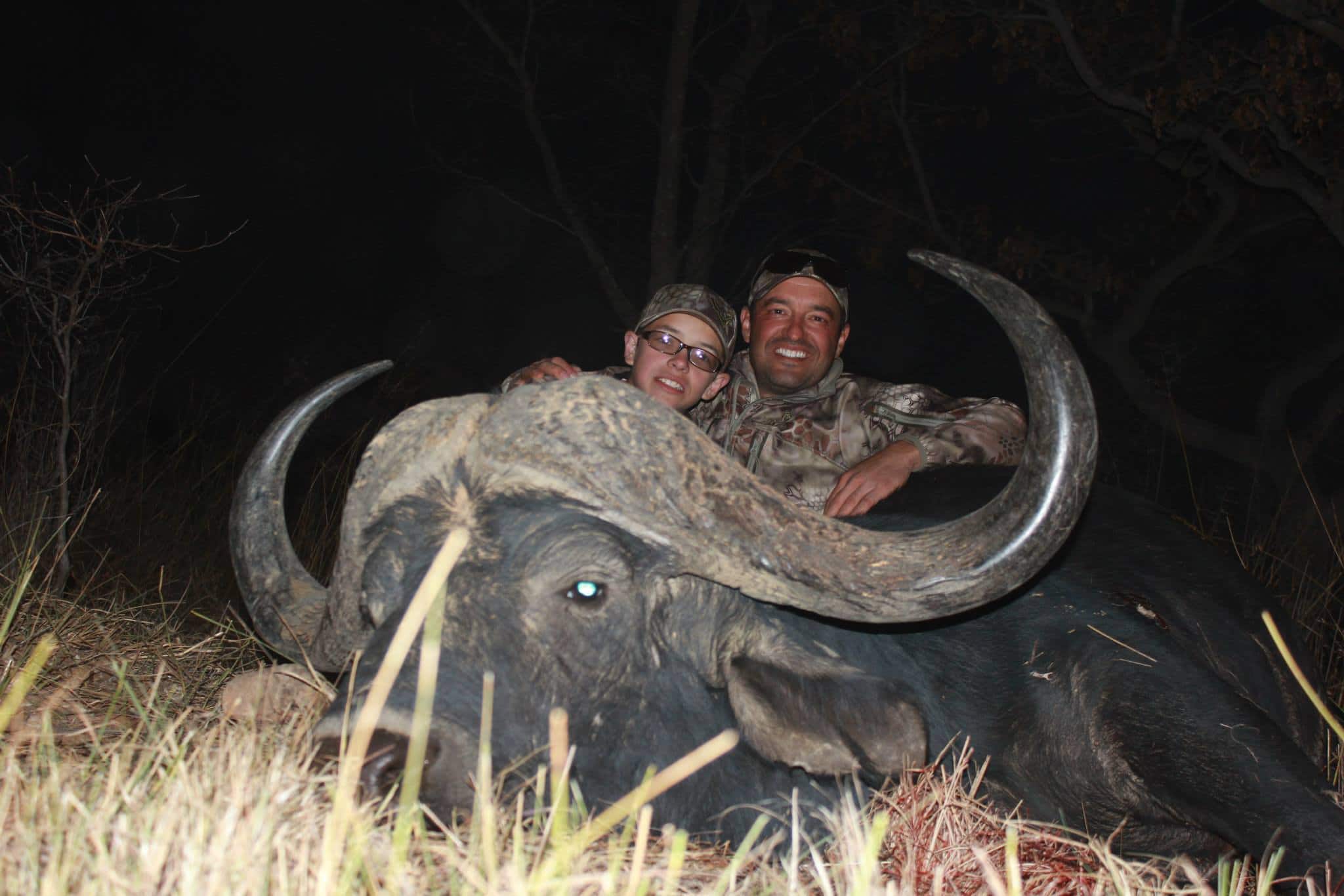 Cory Glauner and his son Webb with a giant cape buffalo.